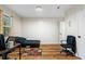 Cozy bedroom with wood floors and a window at 7037 Shangrila Trl, Riverdale, GA 30296