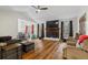 Spacious living room featuring hardwood floors and fireplace at 7037 Shangrila Trl, Riverdale, GA 30296