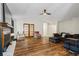 Open living room with hardwood floors, fireplace, and french doors at 7037 Shangrila Trl, Riverdale, GA 30296