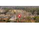 A high angle view of a property with a pool surrounded by mature trees and neighborhood homes at 1119 Oakdale Se Dr, Smyrna, GA 30080