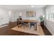 Elegant dining area featuring hardwood floors, a wooden table with chairs, and modern decor at 1119 Oakdale Se Dr, Smyrna, GA 30080