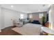 Living room featuring grey couches, blue ottoman, large rug and modern décor at 1119 Oakdale Se Dr, Smyrna, GA 30080