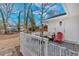 Inviting covered patio area with cozy seating and a stylish patterned rug at 1119 Oakdale Se Dr, Smyrna, GA 30080