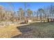 Large backyard with shed and wooded area at 2676 Old Toney Rd, Ellenwood, GA 30294