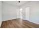 Well-lit bedroom featuring wood-look floors and closets at 2676 Old Toney Rd, Ellenwood, GA 30294