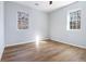 Well-lit bedroom with wood-look floors and windows at 2676 Old Toney Rd, Ellenwood, GA 30294