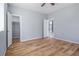 Bedroom with wood-look floors, closet, and access to other rooms at 2676 Old Toney Rd, Ellenwood, GA 30294