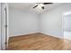 Bright bedroom with wood-look floors and ceiling fan at 2676 Old Toney Rd, Ellenwood, GA 30294