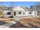 Newly renovated single story home with walkway leading to front door at 2676 Old Toney Rd, Ellenwood, GA 30294