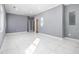 Open concept living area with gray walls and marble floors at 2676 Old Toney Rd, Ellenwood, GA 30294