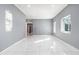 Bright and airy living room with marble-look floors at 2676 Old Toney Rd, Ellenwood, GA 30294