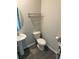 Powder room featuring a pedestal sink, gray walls, and gray wood-look flooring at 3306 Loblolly Pine Way, Decatur, GA 30034