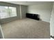 Large bonus room with neutral carpet and natural light from the window at 3306 Loblolly Pine Way, Decatur, GA 30034