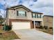 Two-story house with attached garage and landscaping at 3306 Loblolly Pine Way, Decatur, GA 30034