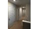 Upstairs hallway with multiple bedrooms and closet doors at 3306 Loblolly Pine Way, Decatur, GA 30034