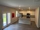 Stylish kitchen with stainless steel appliances, center island, and sliding glass doors at 3306 Loblolly Pine Way, Decatur, GA 30034