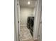 A clean laundry room with washer and dryer hookups, and vinyl flooring at 3306 Loblolly Pine Way, Decatur, GA 30034