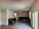 Open-concept living room with gray walls, wood-look flooring, and contemporary furnishings at 3306 Loblolly Pine Way, Decatur, GA 30034