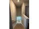 Stairway featuring neutral walls with wood banister and carpeted stairs at 3306 Loblolly Pine Way, Decatur, GA 30034