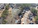 Aerial view of home in a neighborhood surrounding a pond at 5073 Kingsbridge Pass, Powder Springs, GA 30127