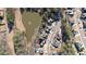 Aerial view of home in a neighborhood surrounding a pond at 5073 Kingsbridge Pass, Powder Springs, GA 30127