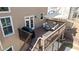 Aerial view of back deck with an umbrella, dining table and seating at 5073 Kingsbridge Pass, Powder Springs, GA 30127