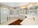 Bright bathroom with a vanity, soaking tub, and separate glass-enclosed shower at 5073 Kingsbridge Pass, Powder Springs, GA 30127