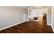 Bonus room with wood floors, baseboard trim, and an entry to the adjacent main bedroom at 5073 Kingsbridge Pass, Powder Springs, GA 30127