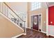 Elegant foyer featuring hardwood floors and a staircase leading to the second floor at 5073 Kingsbridge Pass, Powder Springs, GA 30127