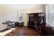 A functional home office featuring custom built-ins, hardwood floors, and abundant natural light at 5073 Kingsbridge Pass, Powder Springs, GA 30127