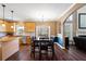 Spacious kitchen with wood cabinets, dining table, and stainless appliances at 5073 Kingsbridge Pass, Powder Springs, GA 30127