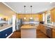 Modern kitchen with stainless appliances, wood cabinets, and tile backsplash at 5073 Kingsbridge Pass, Powder Springs, GA 30127