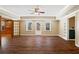 Large living room with wood floors, ceiling fan, and natural light at 5073 Kingsbridge Pass, Powder Springs, GA 30127