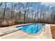 Beautiful in-ground swimming pool with diving board and fenced backyard at 5073 Kingsbridge Pass, Powder Springs, GA 30127