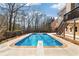 Enjoy outdoor fun with a large private pool, diving board and adjacent deck at 5073 Kingsbridge Pass, Powder Springs, GA 30127