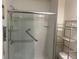 Bathroom with walk-in shower and storage shelving at 5396 Pennington Court, Atlanta, GA 30349