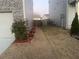 Narrow side yard with patchy grass and landscaping at 5396 Pennington Court, Atlanta, GA 30349