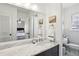 Elegant bathroom featuring a marble countertop and large mirror at 571 Allgood Ne Rd, Marietta, GA 30060