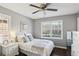 Bright bedroom with ceiling fan, hardwood floors, and neutral decor at 571 Allgood Ne Rd, Marietta, GA 30060