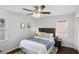 Cozy bedroom with ceiling fan, hardwood floors, and ample natural light at 571 Allgood Ne Rd, Marietta, GA 30060