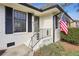 Brick front entry with black accents and American flag at 571 Allgood Ne Rd, Marietta, GA 30060