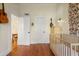 Bedroom with crib, dresser, and access to other rooms at 764 Edgewood Ne Ave # 8, Atlanta, GA 30307