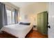 Bright bedroom with a queen-size bed and hardwood floors at 764 Edgewood Ne Ave # 8, Atlanta, GA 30307