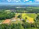 Comprehensive aerial image of the property, highlighting its spacious layout and horse facilities at 1820 Walker Sw Rd, Conyers, GA 30094