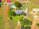 Expansive aerial view of the estate, highlighting the pool, circular driveway, and lush greenery at 1820 Walker Sw Rd, Conyers, GA 30094