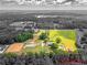 Wide aerial photo of the estate displaying the paddocks, horse barn, and the proximity to the house at 1820 Walker Sw Rd, Conyers, GA 30094