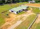 Aerial view of barn with fenced paddocks, offering ample space for horses and equipment at 1820 Walker Sw Rd, Conyers, GA 30094