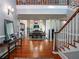 Inviting foyer with hardwood floors, staircase, and a view into the dining and living spaces at 1820 Walker Sw Rd, Conyers, GA 30094