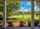 Inviting front yard view showcasing the spacious lawn with white fencing on a sunny day at 1820 Walker Sw Rd, Conyers, GA 30094