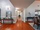 Hallway with hardwood floors, columns, and a view of the staircase at 1820 Walker Sw Rd, Conyers, GA 30094